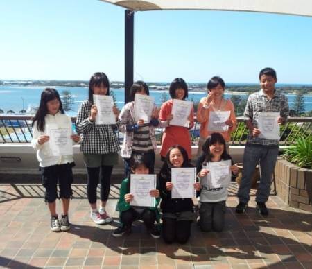Kids learning English at AICOL with children from all over the world