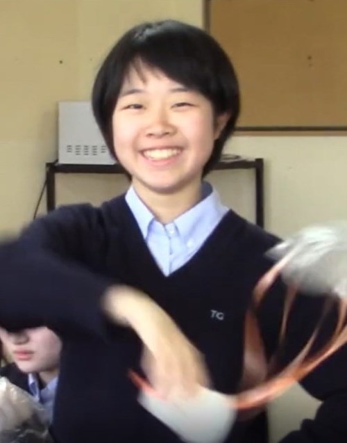 Student in High School Class at AICOL