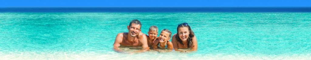 Students at beach enjoying free AICOL holiday