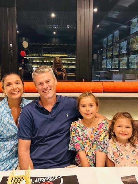 Homestay family at hotel with students.