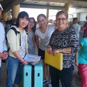 Homestay family meeting students arriving at AICOL